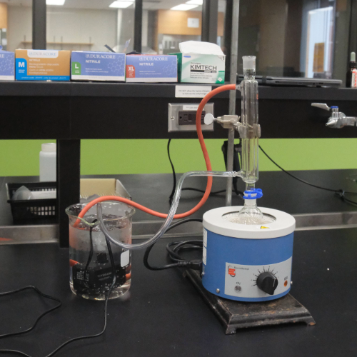 The chemistry lab’s reflux setup where water is pumped through the condenser loop and recycled.